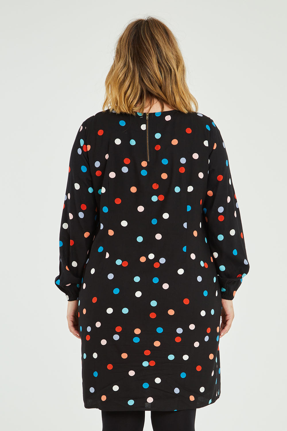 Model Jess wearing size 14 of the Katy Shift Dress in colour Dot (Black), from the back