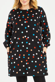 Model Jess wearing size 14 of the Katy Shift Dress in colour Dot (Black), from the front, cropped image