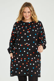 Model Jess wearing size 14 of the Katy Shift Dress in colour Dot (Black), from the front, cropped image