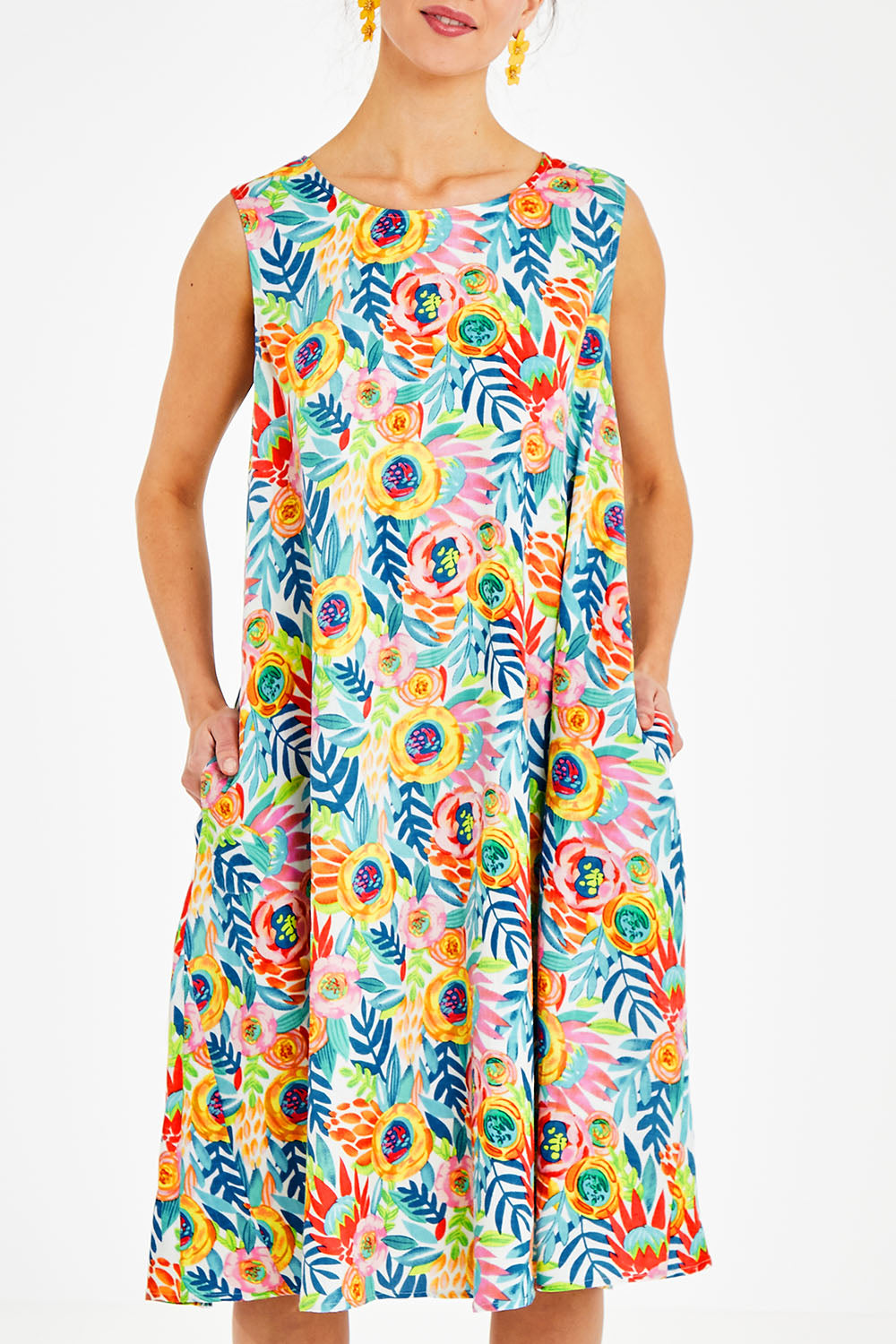 Model Courtney wearing size 10 of the Zoey Shift Dress in colour Meadow (Blue), from the front, cropped image