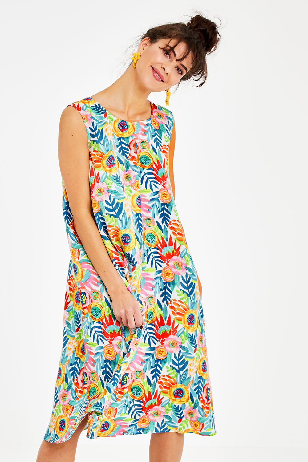 Model Courtney wearing size 10 of the Zoey Shift Dress in colour Meadow (Blue), from the front, cropped image