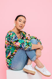 Model Katie wearing size 10 of the Julia 3/4 Sleeve Top in colour Rainforest (Blue), from the front, showing the whole outfit