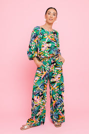 Model Katie wearing size 10 of the Julia 3/4 Sleeve Top in colour Rainforest (Blue), from the front, showing the whole outfit