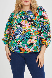 Model Keeara wearing size 16 of the Julia 3/4 Sleeve Top in colour Rainforest (Blue), from the front, cropped image