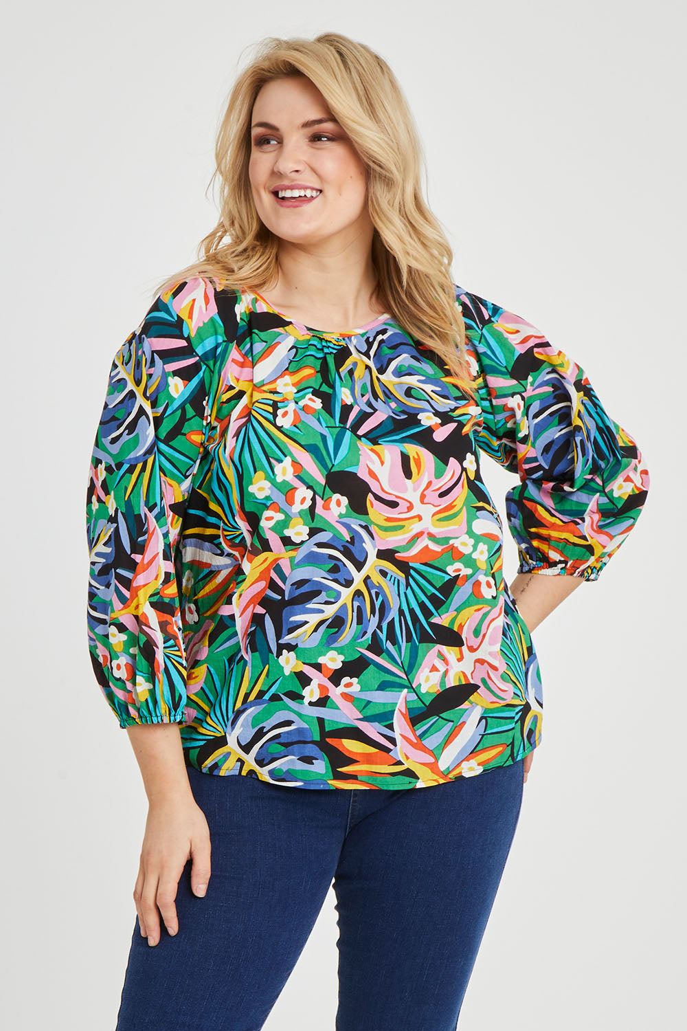 Model Keeara wearing size 16 of the Julia 3/4 Sleeve Top in colour Rainforest (Blue), from the front, cropped image