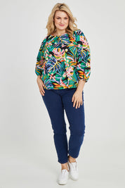 Model Keeara wearing size 16 of the Julia 3/4 Sleeve Top in colour Rainforest (Blue), from the front, showing the whole outfit