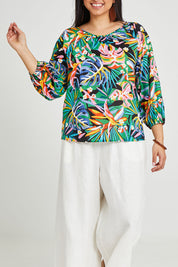 Model Terri-Leigh wearing size 14 of the Julia 3/4 Sleeve Top in colour Rainforest (Blue), from the front, cropped image