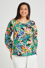 Model Terri-Leigh wearing size 14 of the Julia 3/4 Sleeve Top in colour Rainforest (Blue), from the front, cropped image
