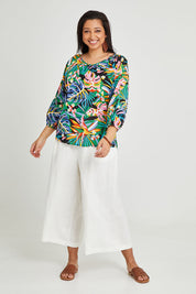 Model Terri-Leigh wearing size 14 of the Julia 3/4 Sleeve Top in colour Rainforest (Blue), from the front, showing the whole outfit
