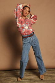 Model Katie wearing size 10 of the Jess Cotton Blouse in colour Rosettes, from the front, showing the whole outfit