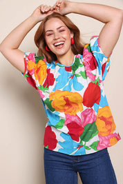 Model Georgiel wearing size 10 of the Rachel Cotton Top – Botanix in colour Botanix, in a cropped view