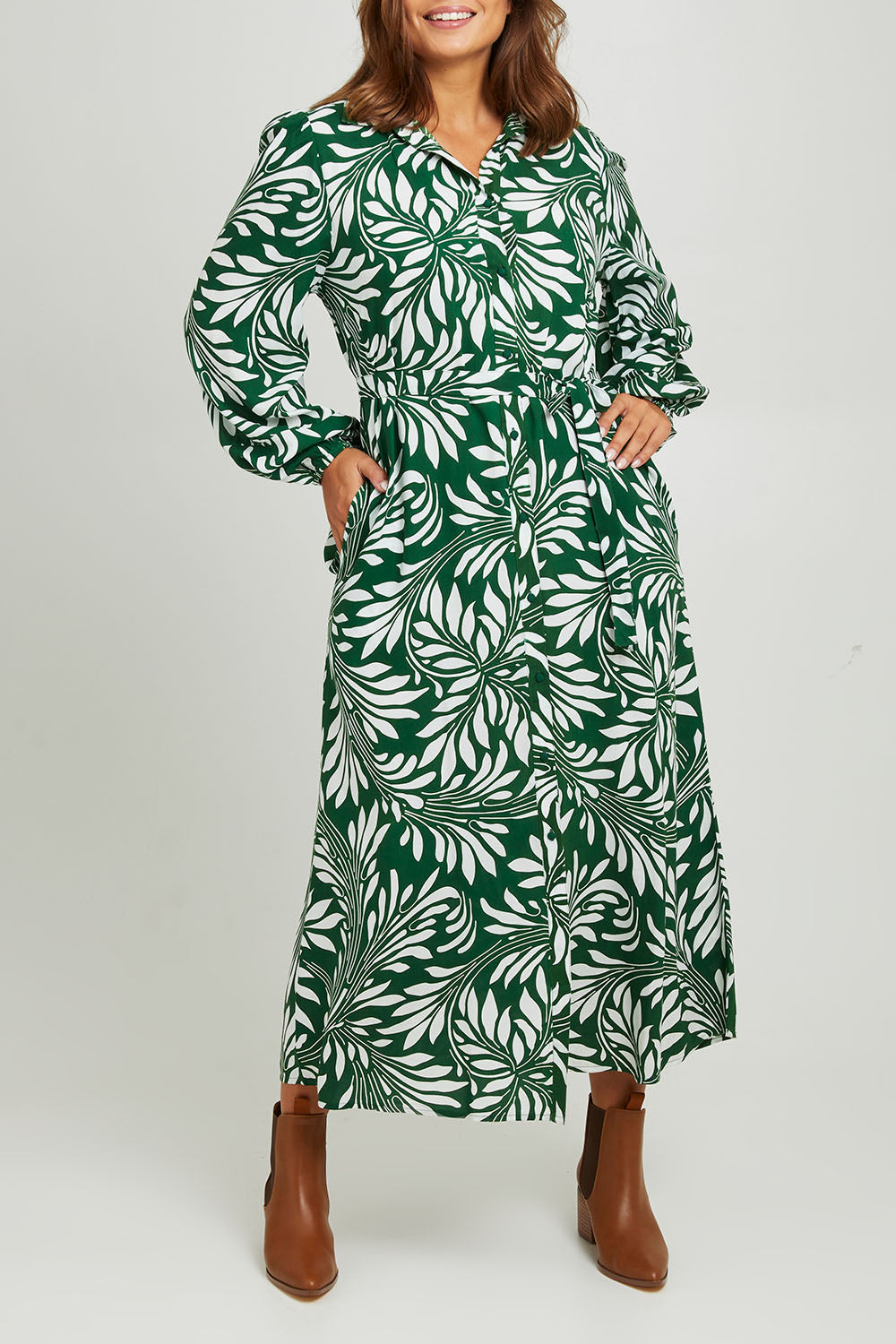 Model Monique wearing size 14 of the Lucy Shirt Dress in colour Swirl (Green), from the front, cropped image