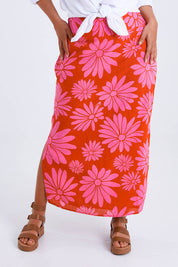Model Monique wearing size 14 of the Clara Maxi Skirt in colour Bolddaisy (Red), from the front, cropped image