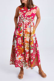 Model Monique wearing size 14 of the Monica Maxi Dress in colour Garden (Pink), from the front, cropped image