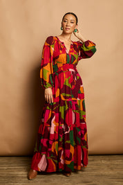 Model Katie wearing size 10 of the Gabbie Maxi Dress in colour Marble (Red), from the front, showing the whole outfit