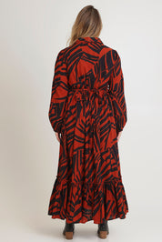 Model Chanel wearing size 16 of the Nikki Cotton Maxi Dress in colour Tigerleaf, from the back