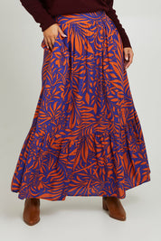 Model Monique wearing size 14 of the Harper Skirt in colour Gardenmaze (Blue), from the front, cropped image