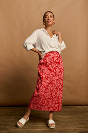 Model Katie wearing size 10 of the Camilla Cotton Scalloped Hem Skirt in colour Flowerpop (Red), from the front, showing the whole outfit