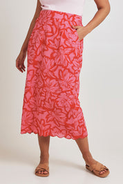 Model Terri-Leigh wearing size 14 of the Camilla Cotton Scalloped Hem Skirt in colour Flowerpop (Red), from the front, cropped image