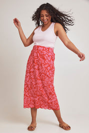 Model Terri-Leigh wearing size 14 of the Camilla Cotton Scalloped Hem Skirt in colour Flowerpop (Red), from the front, showing the whole outfit