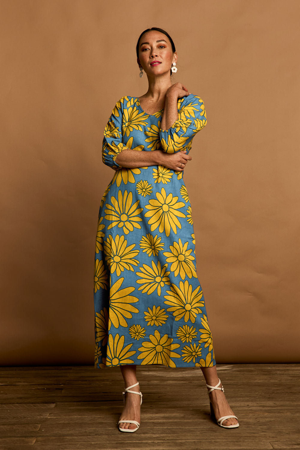 Model Katie wearing size 10 of the Brooke Cotton V Neck Dress in colour Bolddaisy (Blue), from the front, showing the whole outfit
