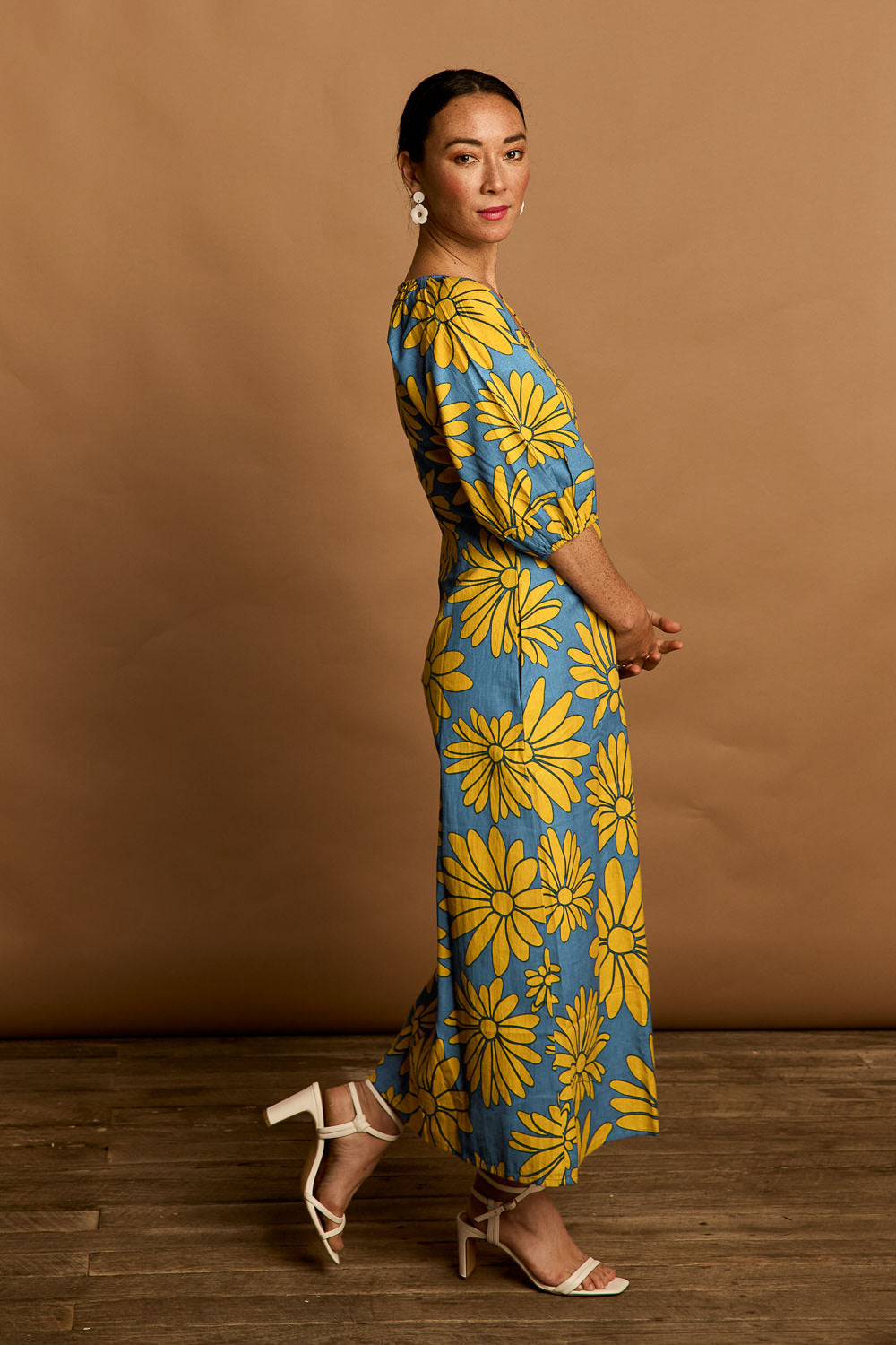 Model Katie wearing size 10 of the Brooke Cotton V Neck Dress in colour Bolddaisy (Blue), from the front, showing the whole outfit