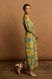 Model Katie wearing size 10 of the Brooke Cotton V Neck Dress in colour Bolddaisy (Blue), from the front, showing the whole outfit
