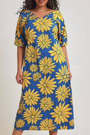 Model Terri-Leigh wearing size 14 of the Brooke Cotton V Neck Dress in colour Bolddaisy (Blue), from the front, cropped image