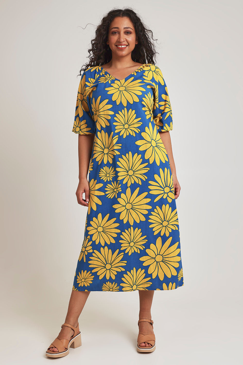 Model Terri-Leigh wearing size 14 of the Brooke Cotton V Neck Dress in colour Bolddaisy (Blue), from the front, showing the whole outfit