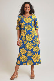 Model Terri-Leigh wearing size 14 of the Brooke Cotton V Neck Dress in colour Bolddaisy (Blue), from the front, showing the whole outfit