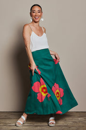 Model Katie wearing size 10 of the Rosie Maxi Skirt in colour Boldgreen (Green), from the front, showing the whole outfit