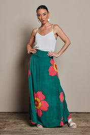 Model Katie wearing size 10 of the Rosie Maxi Skirt in colour Boldgreen (Green), from the front, showing the whole outfit