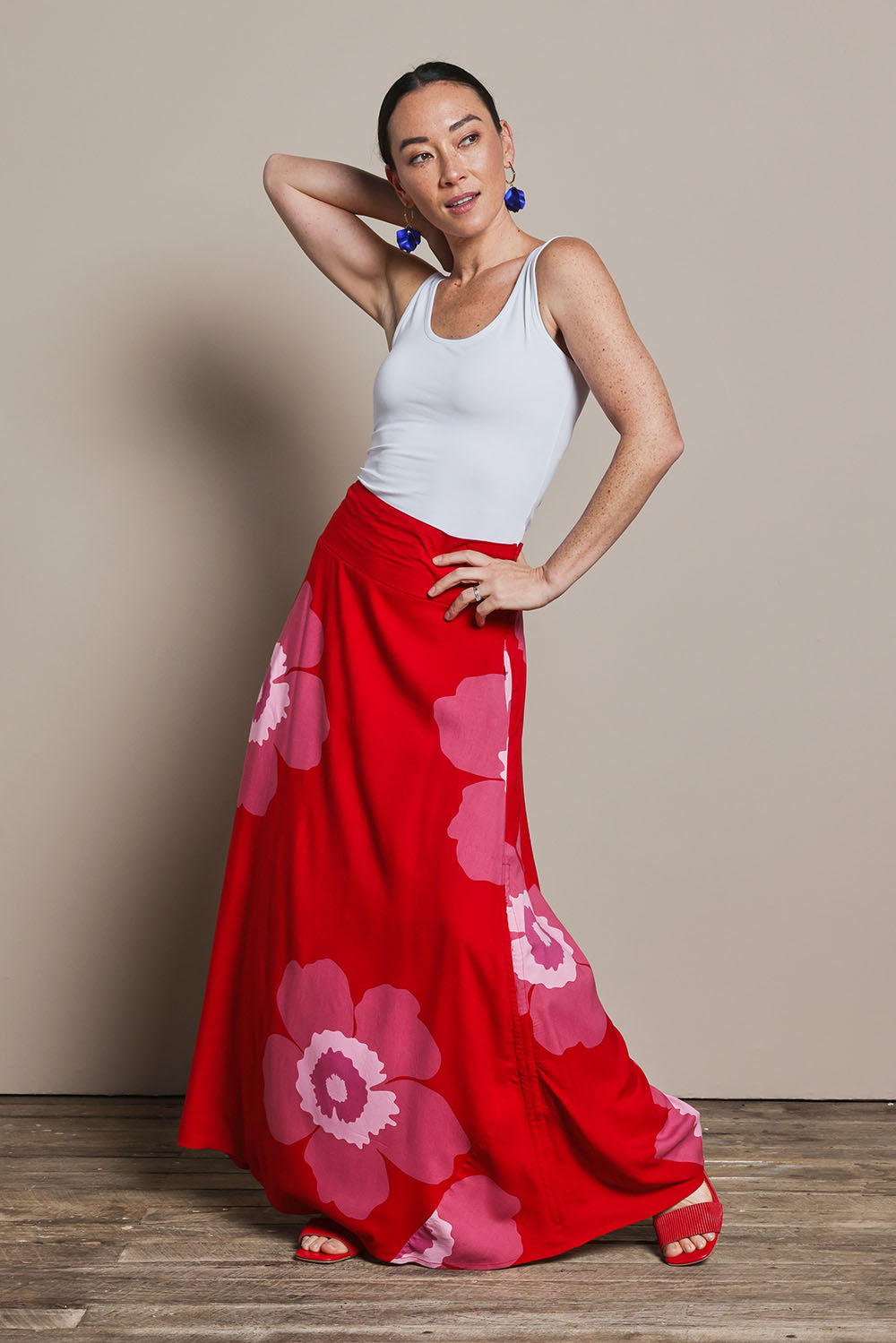 Model Katie wearing size 10 of the Rosie Maxi Skirt in colour Boldred (Red), from the front, showing the whole outfit