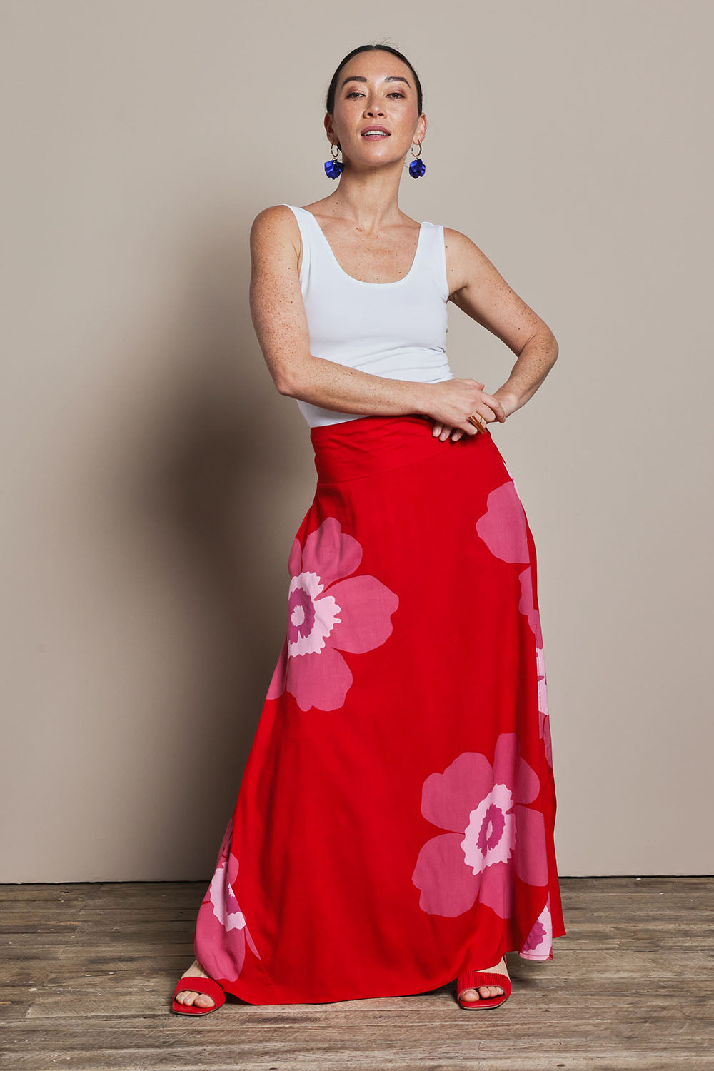 Model Katie wearing size 10 of the Rosie Maxi Skirt in colour Boldred (Red), from the front, showing the whole outfit