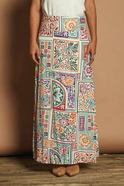Model Katie wearing size 10 of the Rosie Maxi Skirt in colour Labyrinth, from the front, cropped image