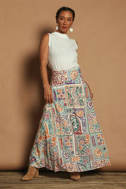 Model Katie wearing size 10 of the Rosie Maxi Skirt in colour Labyrinth, from the front, showing the whole outfit