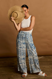 Model Katie wearing size 10 of the Katherine Pant in colour Labyrinth (Blue), from the front, showing the whole outfit