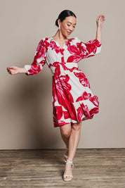 Model Katie wearing size 10 of the Gabrielle Dress in colour Lilly (Pink), from the front, showing the whole outfit