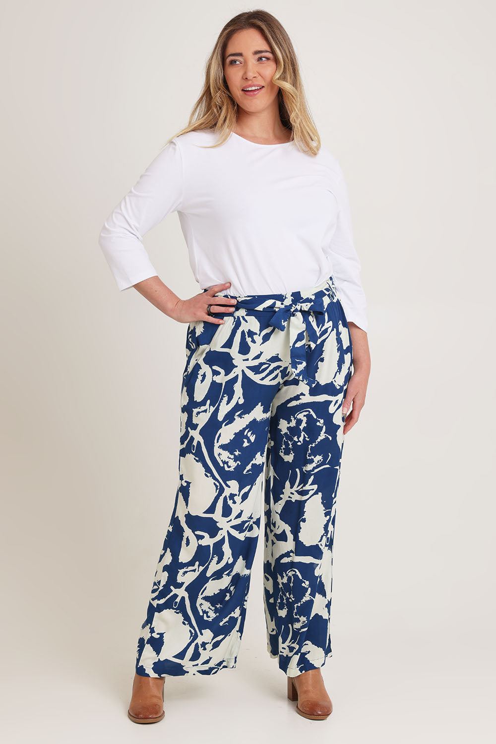 Model Kelly wearing size 16 of the Kayla Pant in colour Inkblot (Blue), from the front, showing the whole outfit