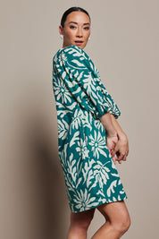 Model Katie wearing size 10 of the Josephine Cotton Dress in colour Gerbera (Green), from the front, cropped image