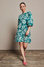 Model Katie wearing size 10 of the Josephine Cotton Dress in colour Gerbera (Green), from the front, showing the whole outfit