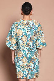 Model Katie wearing size 10 of the Josephine Cotton Dress in colour Thistle, from the back