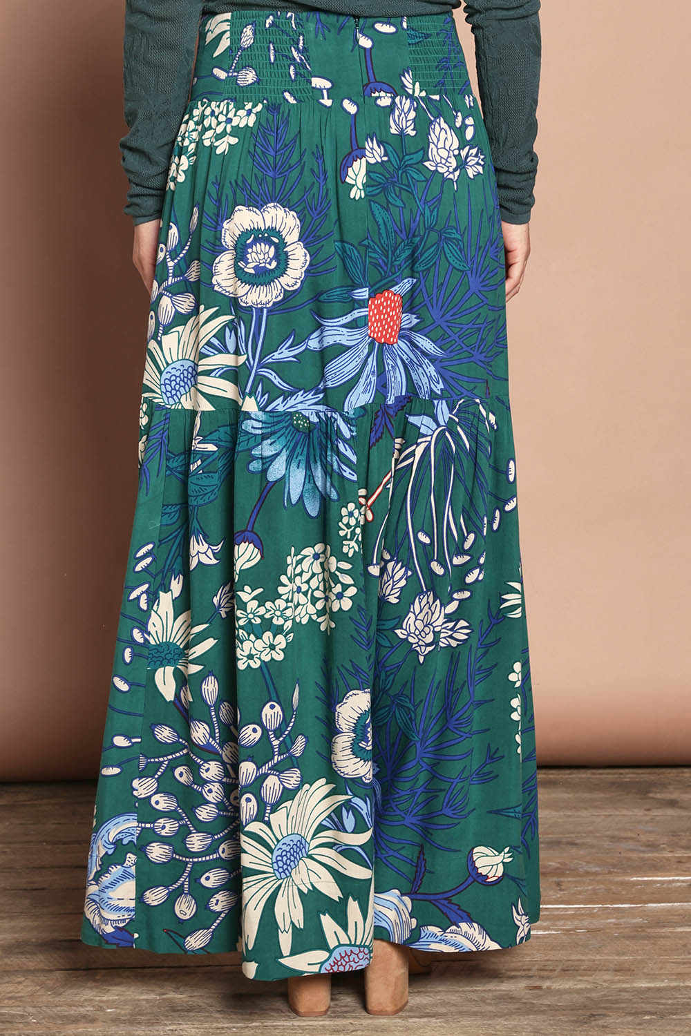 Model Katie wearing size 10 of the Ella Tiered Skirt in colour Deepgreen (Green), from the back