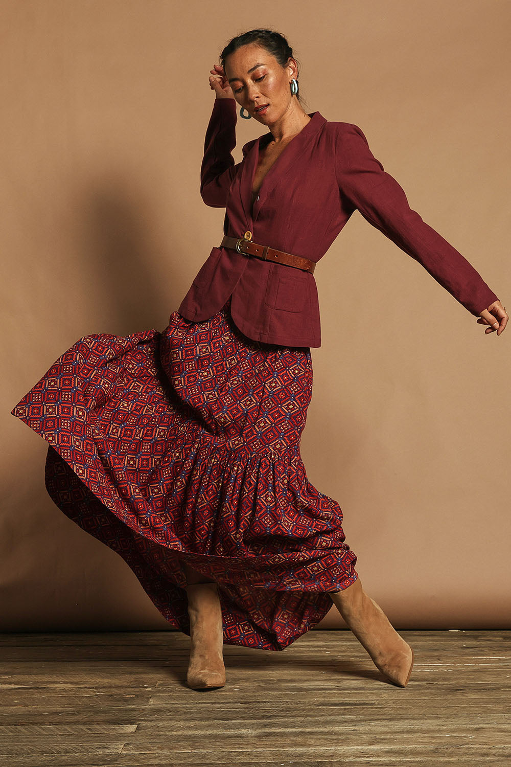 Model Katie wearing size 10 of the Ella Tiered Skirt in colour Geometric, from the front, showing the whole outfit