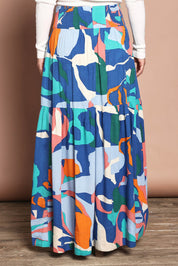 Model Katie wearing size 10 of the Ella Tiered Skirt in colour Marble (Blue), from the back