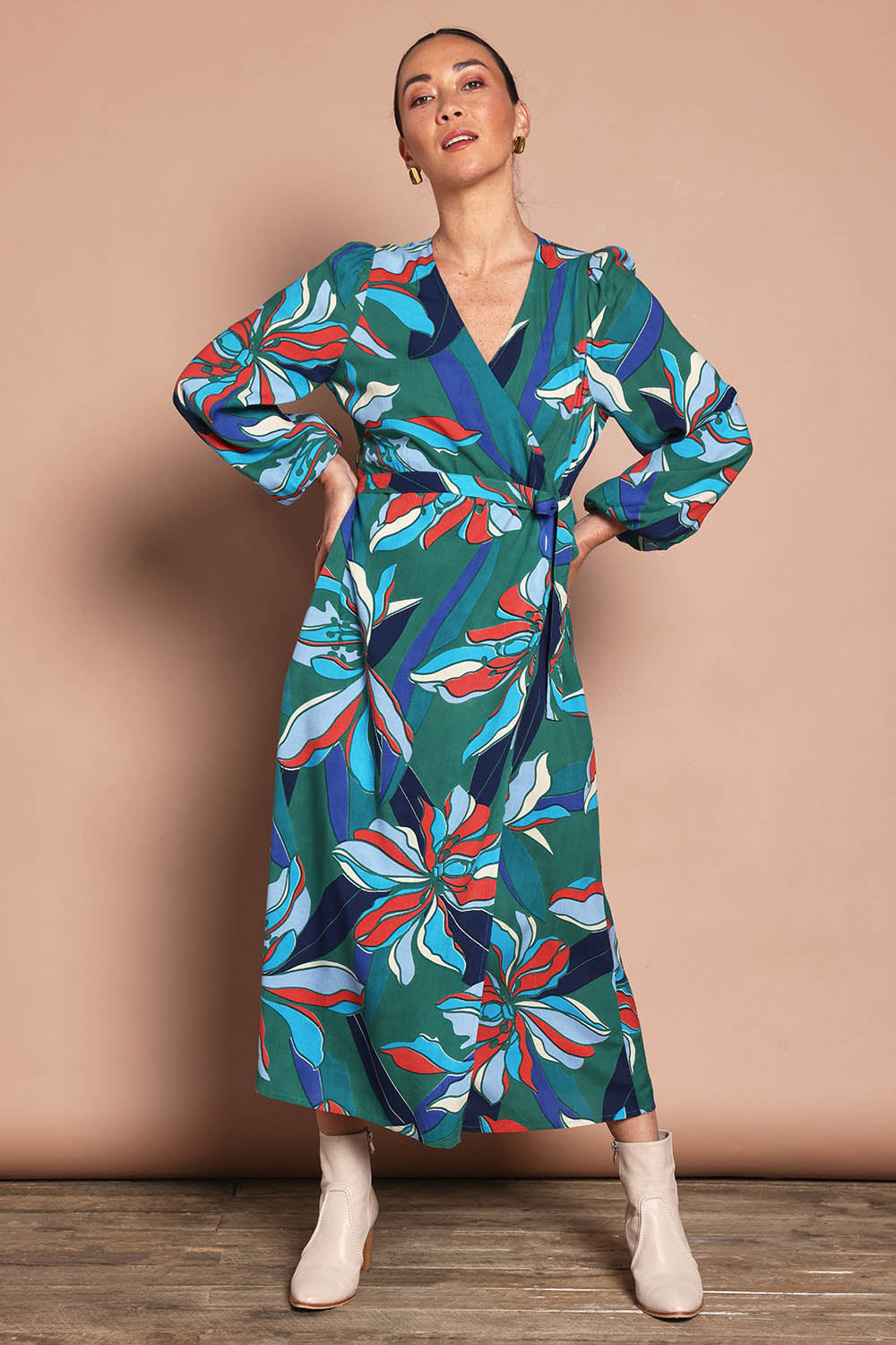 Model Katie wearing size 10 of the Derek Wrap Midi Dress in colour Petalrush, from the front, showing the whole outfit