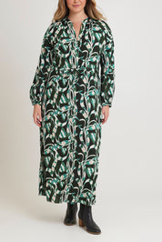 Model Chanel wearing size 16 of the Taylor Button Up Dress in colour Twistvine (Green), from the front, cropped image