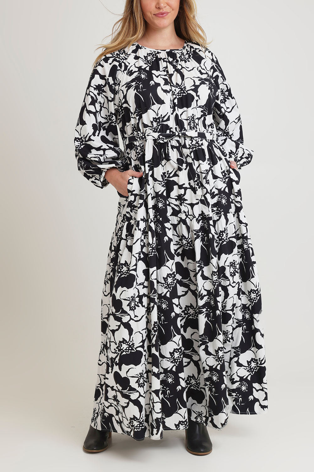 Model Chanel wearing size 16 of the Ruth Cotton Maxi Dress in colour Windfleur (Black), from the front, cropped image