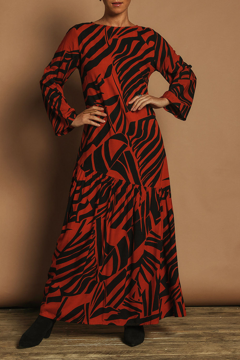 Model Katie wearing size 10 of the Ola Asymmetric Seam Dress in colour Tigerleaf, from the front, cropped image