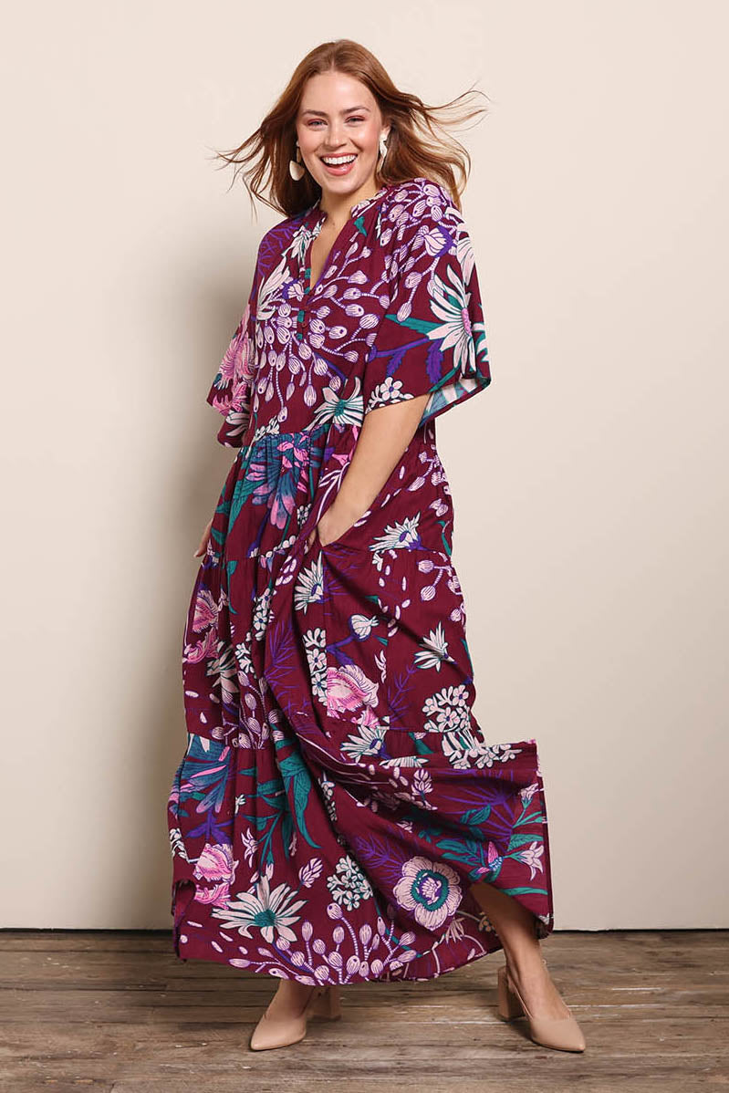 Model Georgiel wearing size 10 of the Katherine Cotton Tired Dress – Garden in colour Garden, from the front